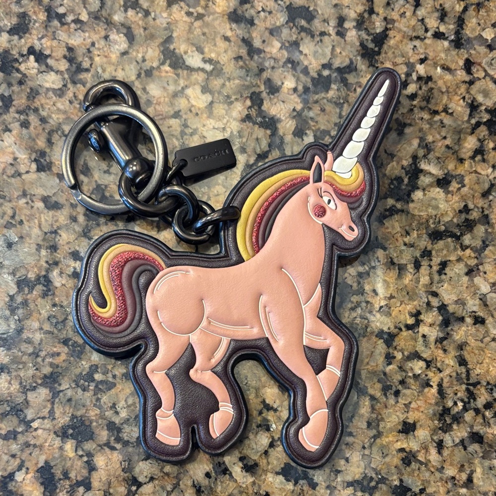COACH Unicorn Keychain with Pink and Brown Accents in pristine condition.